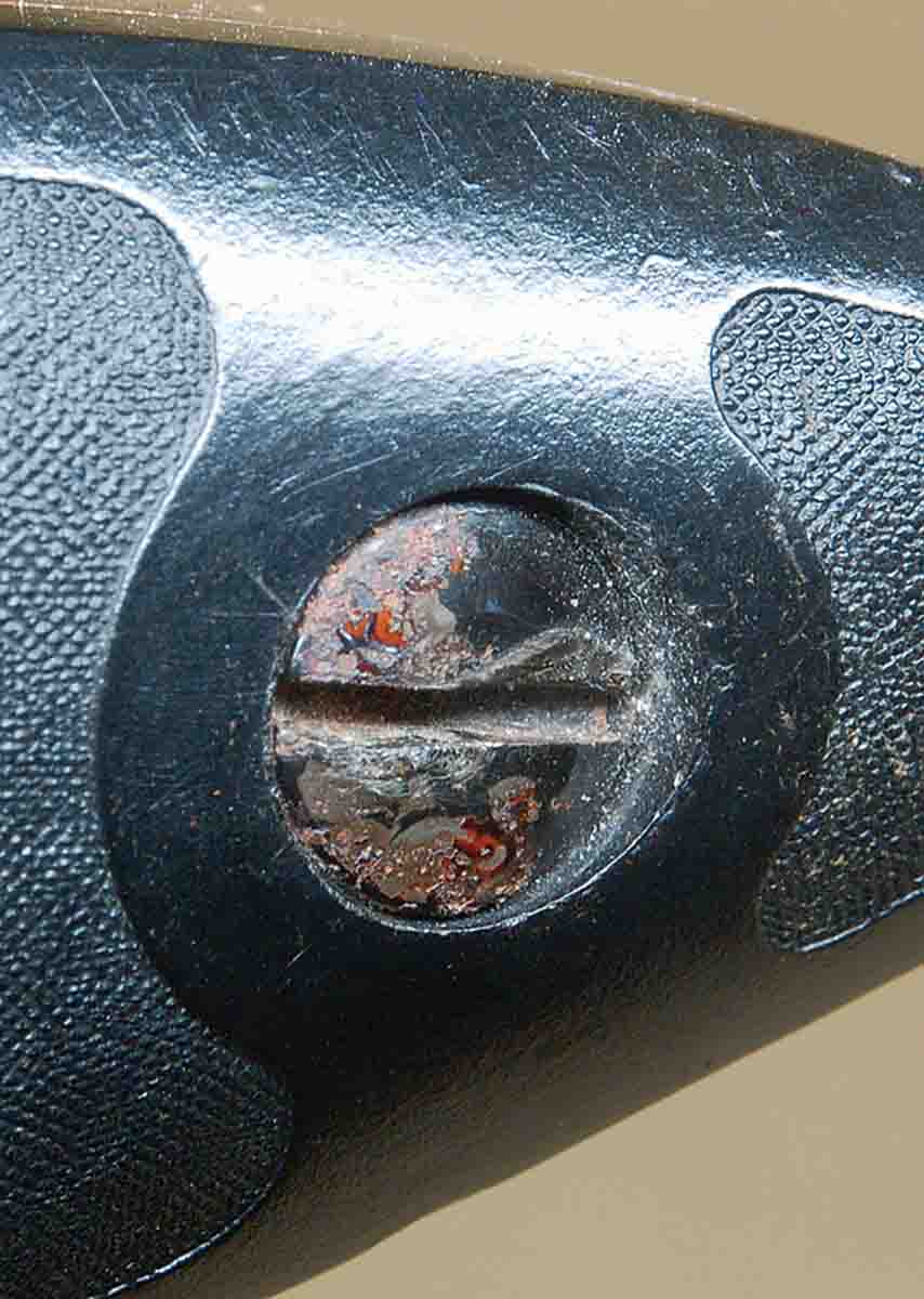This buttplate screw on a “salt wood” Browning T-Bolt (note rust on screw head) is permanent unless ground out.